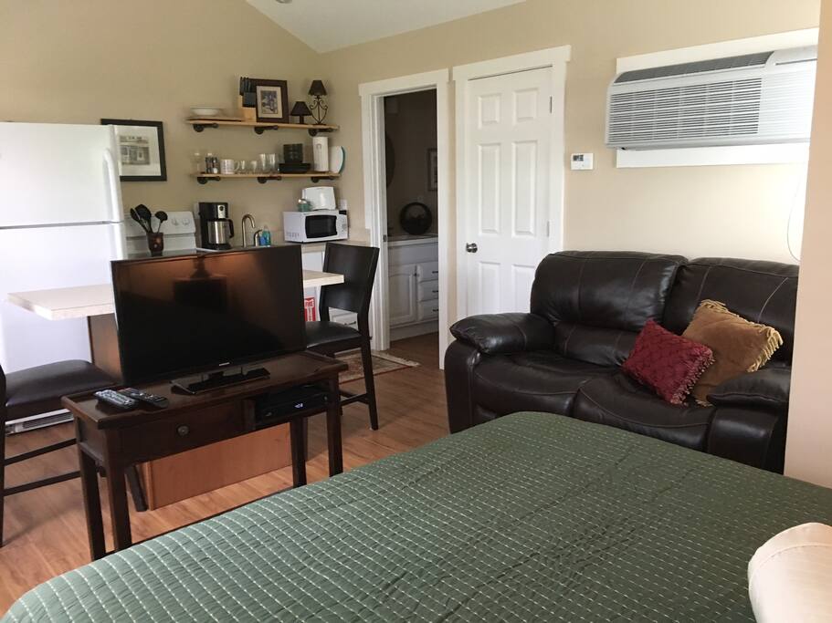 Queen size bed and dual reclining leather loveseat