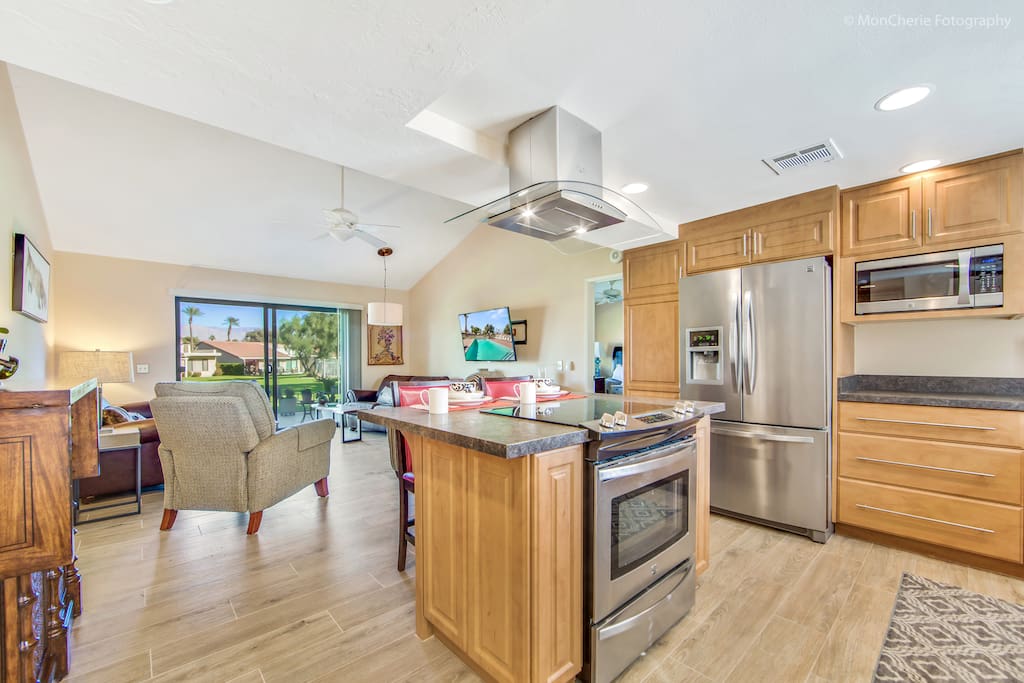 Open kitchen, living room, with view of greenbelt.