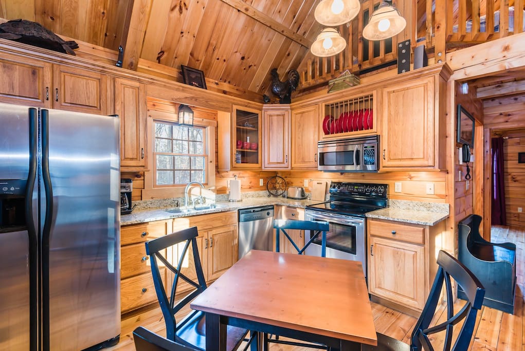 Well appointed kitchen with hand-made hickory cabinets.
