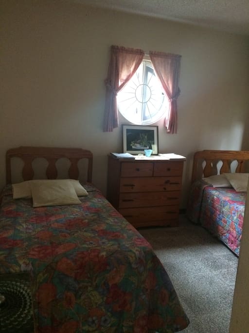 This is Your comfortable bedroom, 2 twin beds, chest with drawers, closet and a night table.
