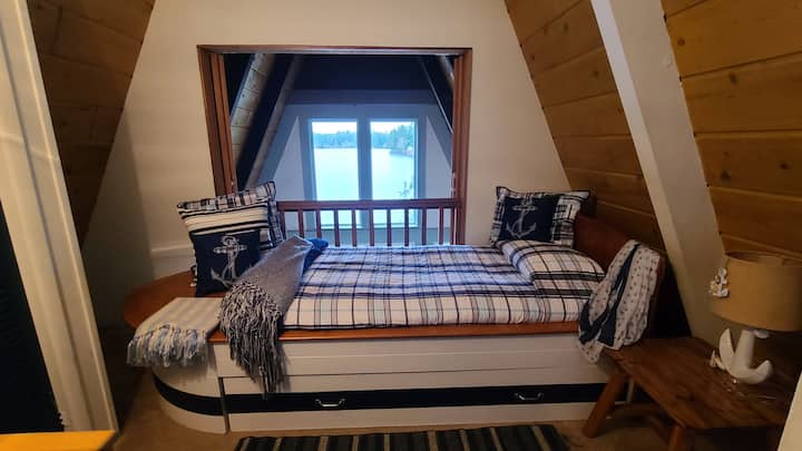 Upstairs Loft Bedroom has unique XL Twin boat bed with Ghost (Crazy Comfy!) mattress and absolutely KILLER VIEW!!  Fun for everyone!  Loft doors can close if children sleep in the room.  Please supervise children in this room and on the stairs.  