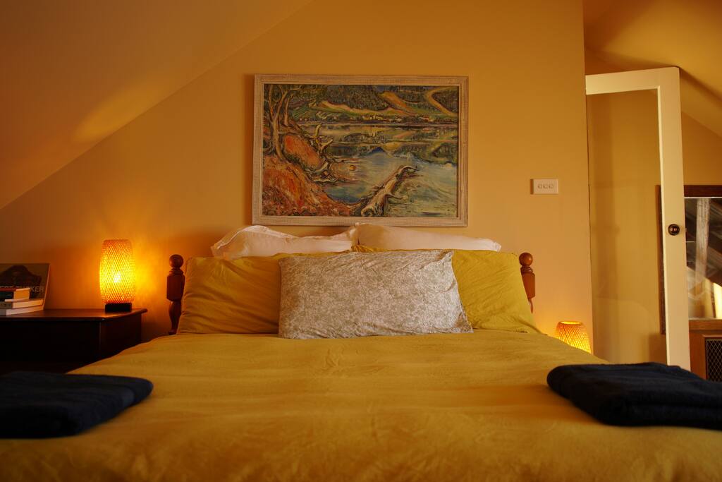 Queen size bed, quality pillows, original artwork
