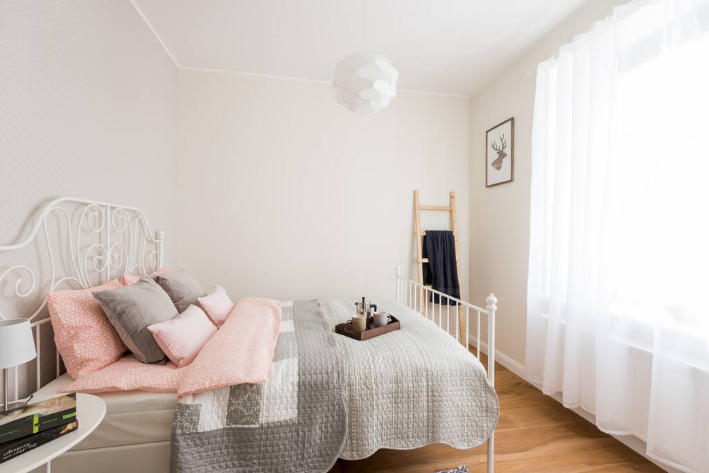 The apartment has a cosy bedroom fitted with a good king-size bed.