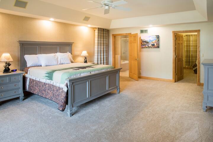 Bear theme master suite with king bed and single bed in the large closet, on the main level