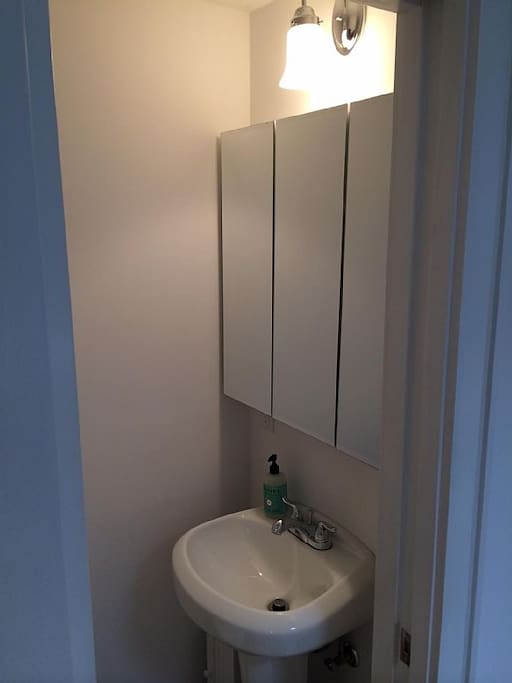 Vented Toilet/Powder Room w pocket door.