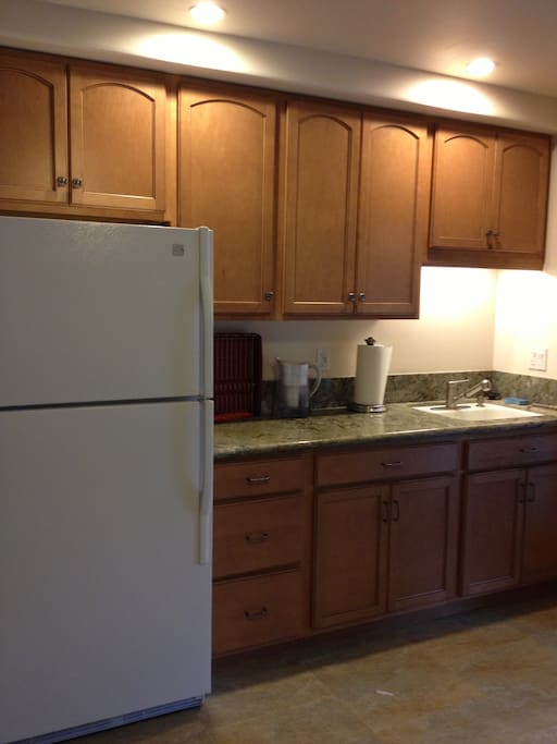 Just a small portion of the very large kitchen area. Granite counter tops and all kinds of cooking implements.