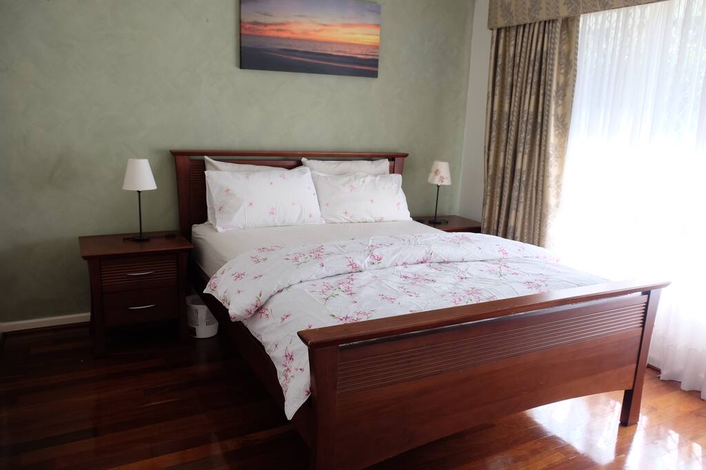 Master bedroom with the view to the park in front of the house