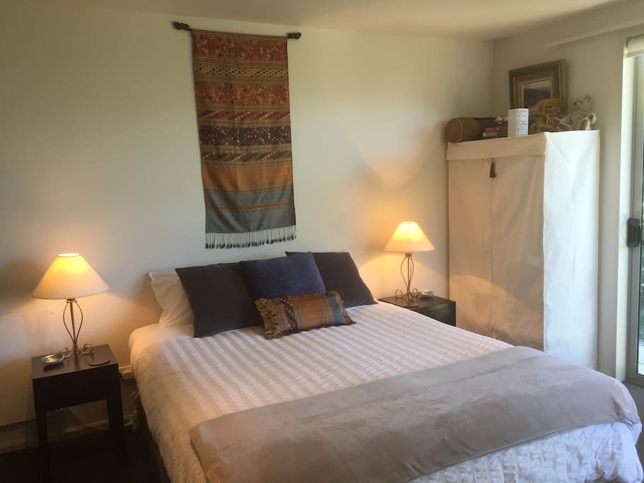 Queen Bed. Entry door to the right