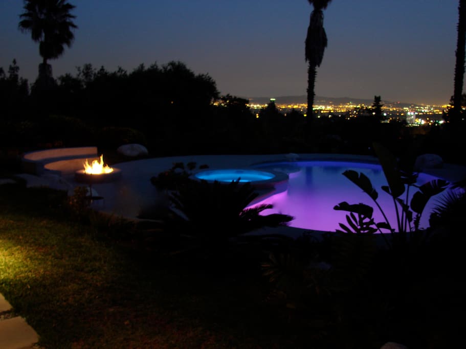 sit by the fire pit and watch the twinking city lights below.