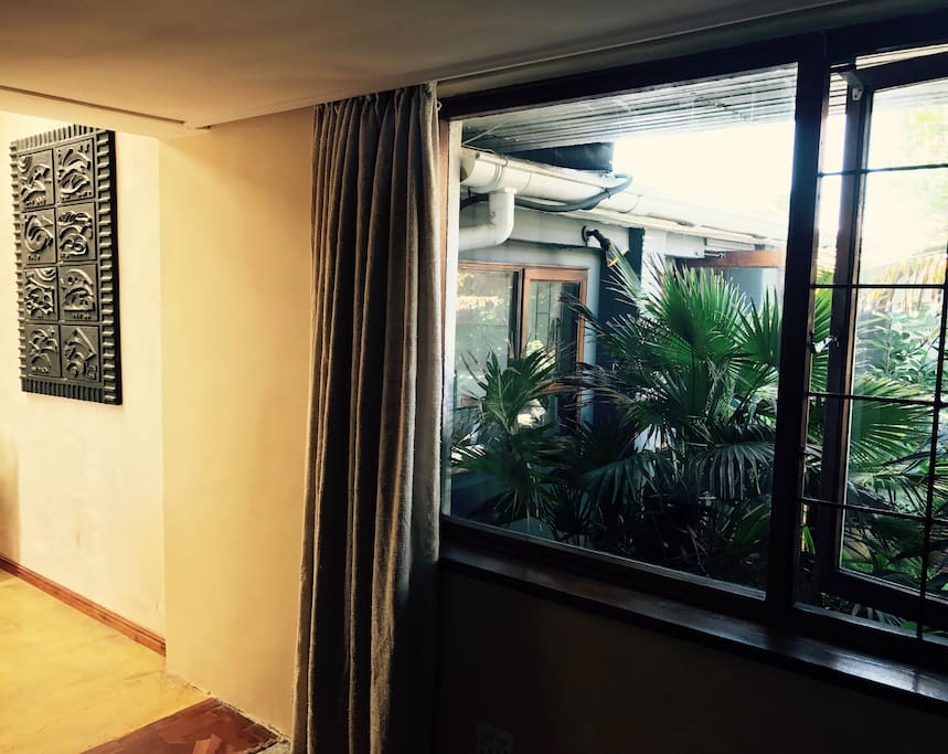 Master bedroom's got a big window into the yard.