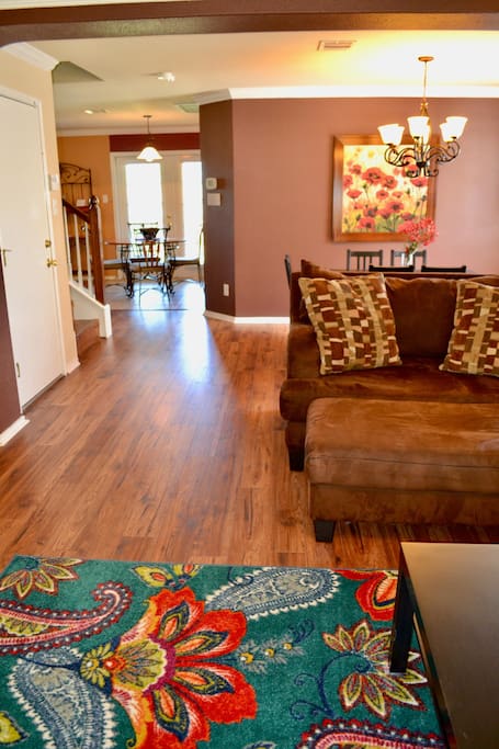 Spacious entry showcases family room and dining area
