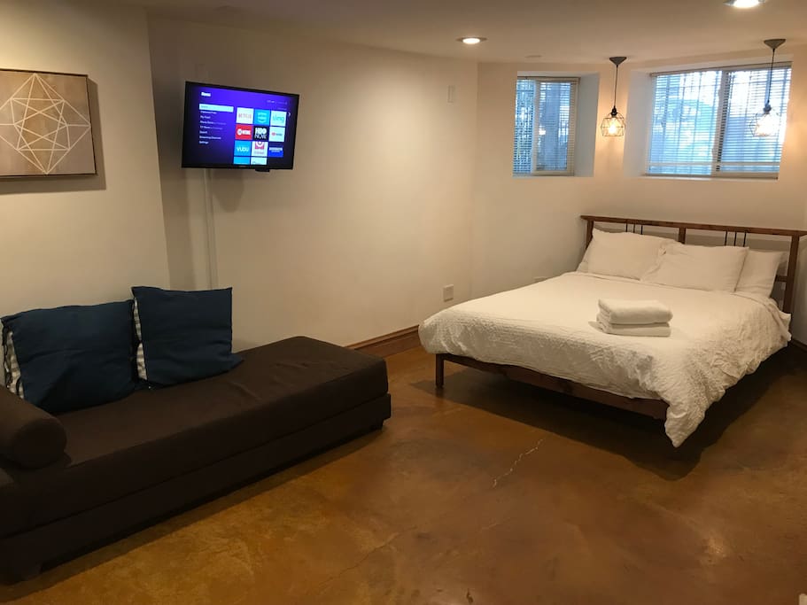 CB2 daybed for lounging or the additional guest. Flat screen wall mounted TV with Hulu, Netflix, and Amazon Prime video. Stay caught up on your favorite shows.