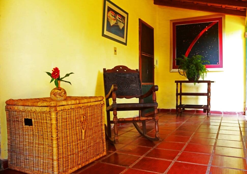 The hallway, at the entrance of the room.