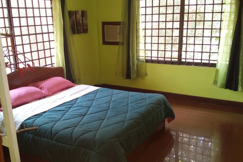 Bed room 2 with bathroom and AC, ceiling fan.