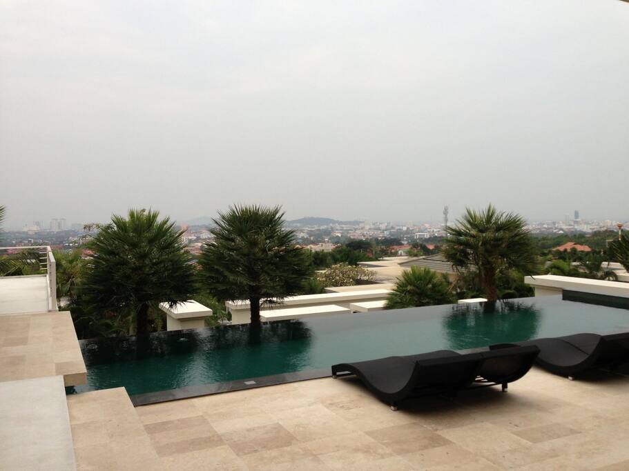 Pool and panoramic view of Pattaya city