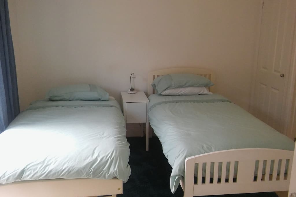 Main bedroom, 2 single beds, en-suite shower and toilet