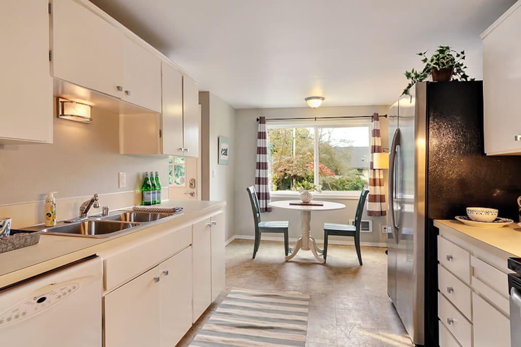 Cozy kitchen with eat in space. Stocked with everything you need for short or long term stays.