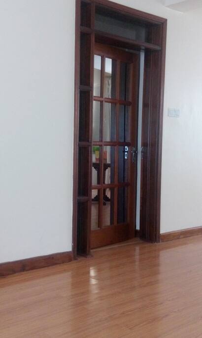 corridor door separating bedrooms and living room