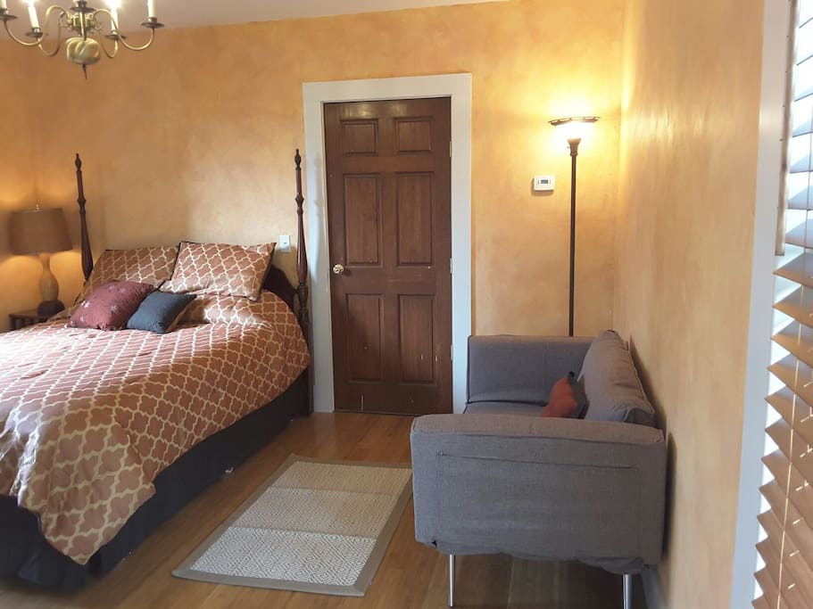 The queen bed and the couch