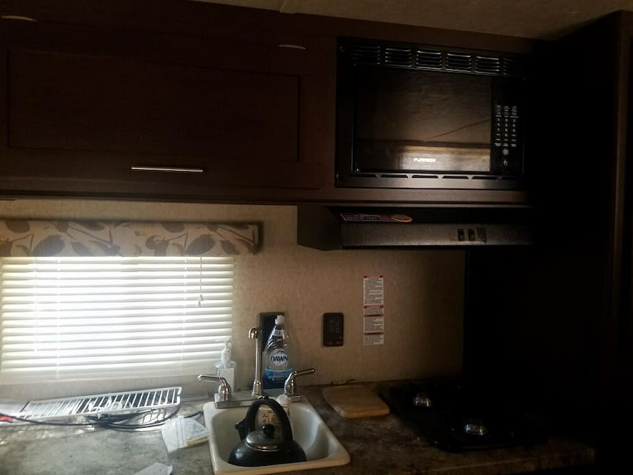 kitchen sink, microwave and stovetop