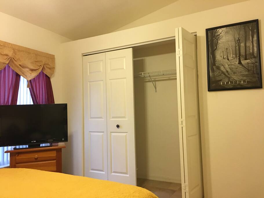 TV, closet, and hangers.