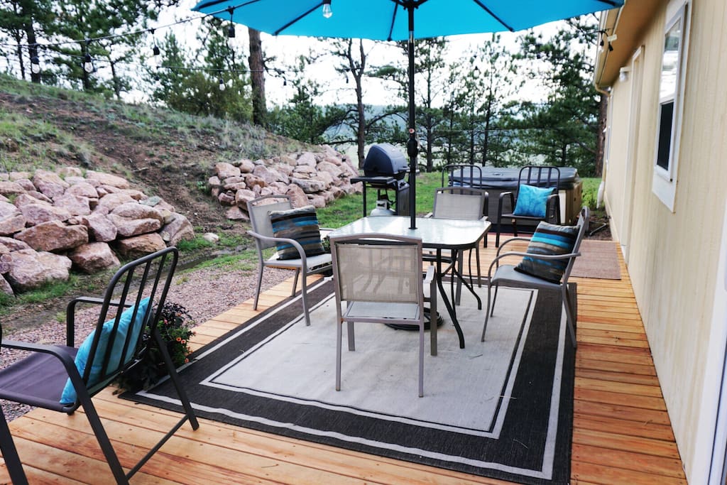 The back deck offers ample seating, a gas grill and a hot tub (not to mention, gorgeous views!)