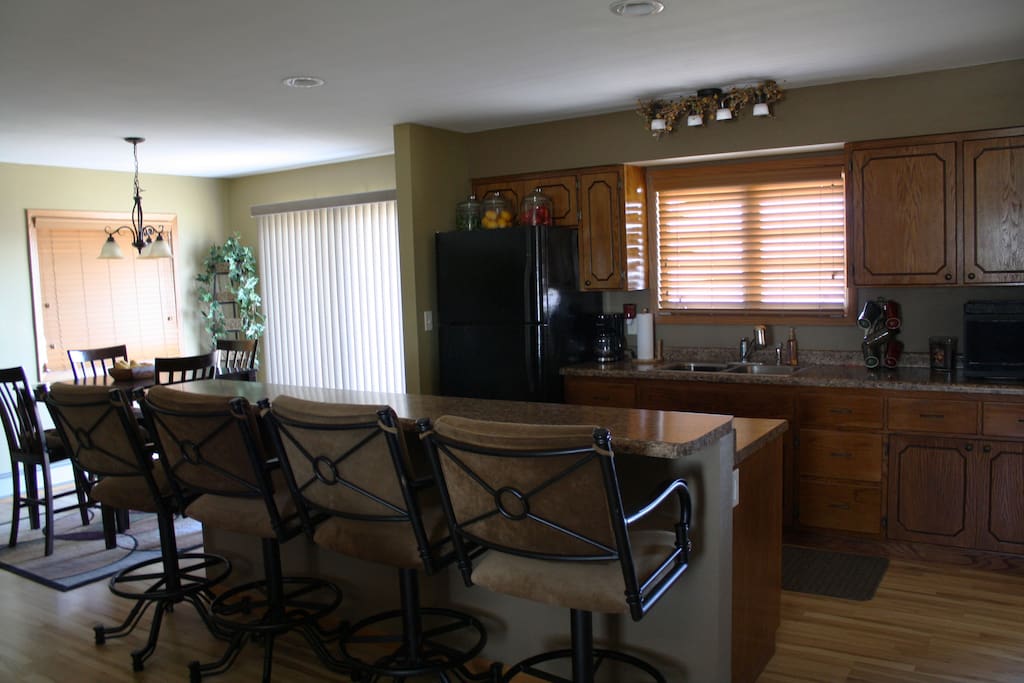 First floor kitchen and bar seating.