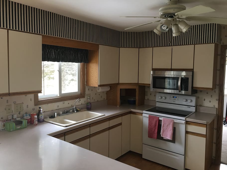 Kitchen with microwave stove dishwasher refrigerator