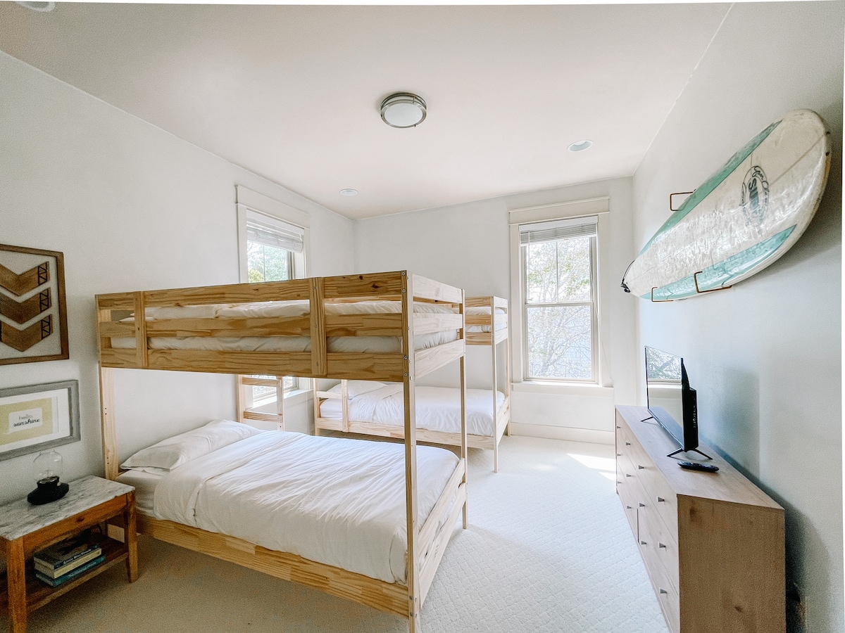 Kids bunk room. Four twin beds and tv for a little screen time. 