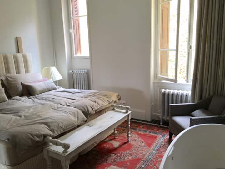 spacious bedroom with free standing bathtub
