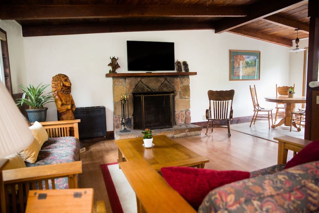 living room with fireplace opens up to dining area