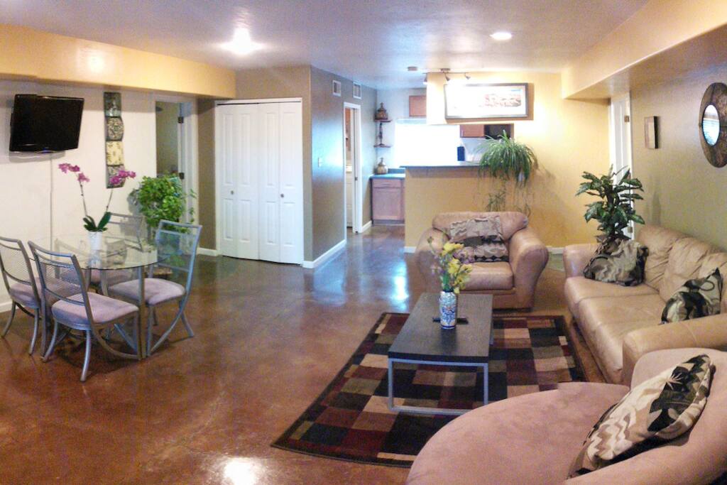 All rooms exit to this large common area furnished with comfortable leather couches and flat screen tv.