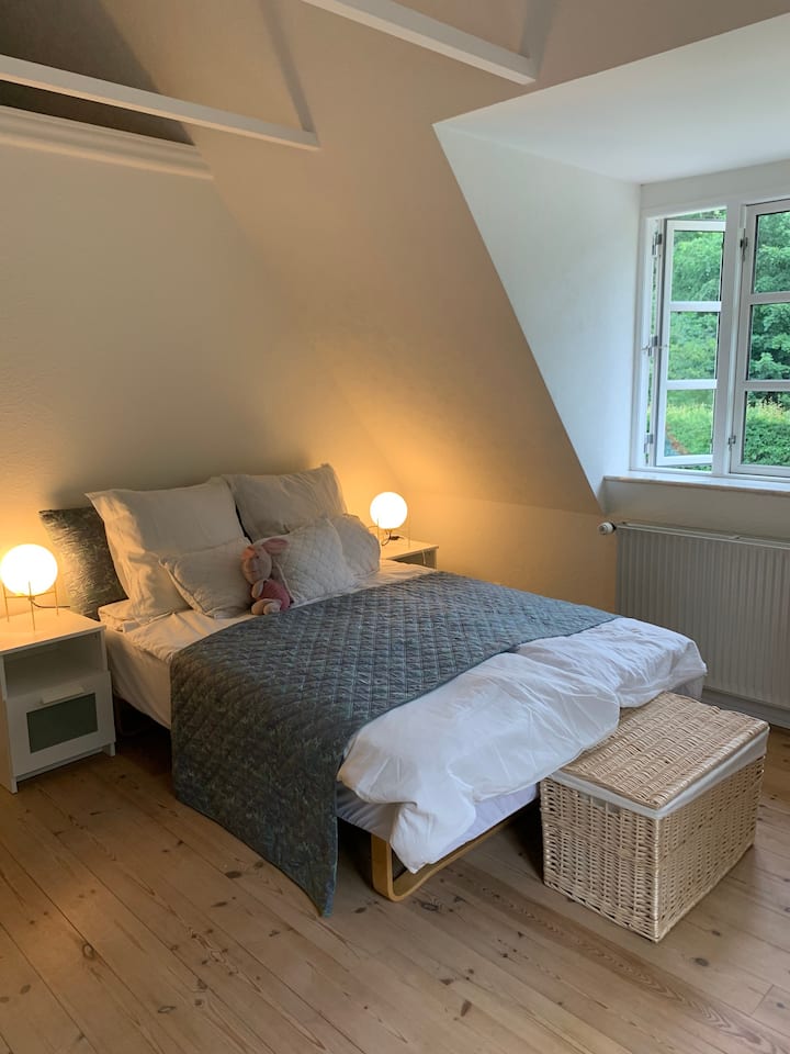 This is the largest of our guest rooms and can sleep 2-3 guests. There is a King size bed in the main room and a single bed in the attic room. The tea garden can be viewed from the french balcony. All the rooms have tea making facilities. 