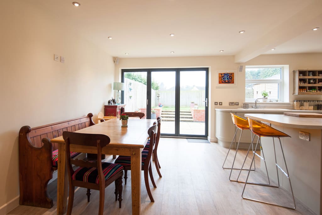 Kitchen with bifold doors onto back patio and garden area.