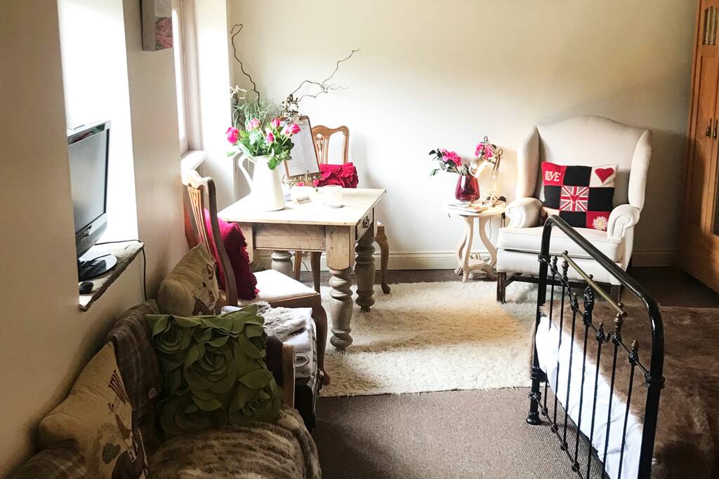Breakfast table with doors that open out to the garden view.