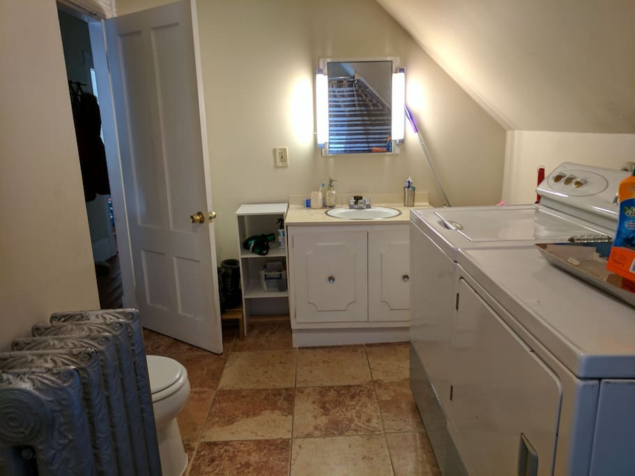 Large Bathroom has full-sized bathtub with shower. Full-sized washing Machine and Dryer for your use.