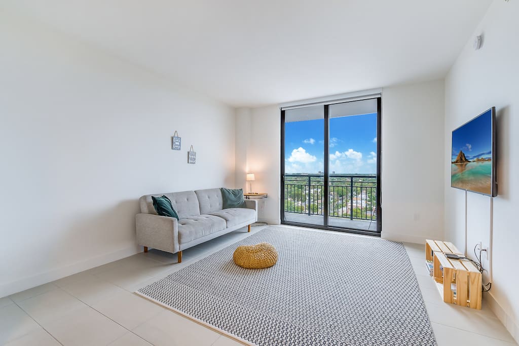 Spacious and modern living room with direct balcony access