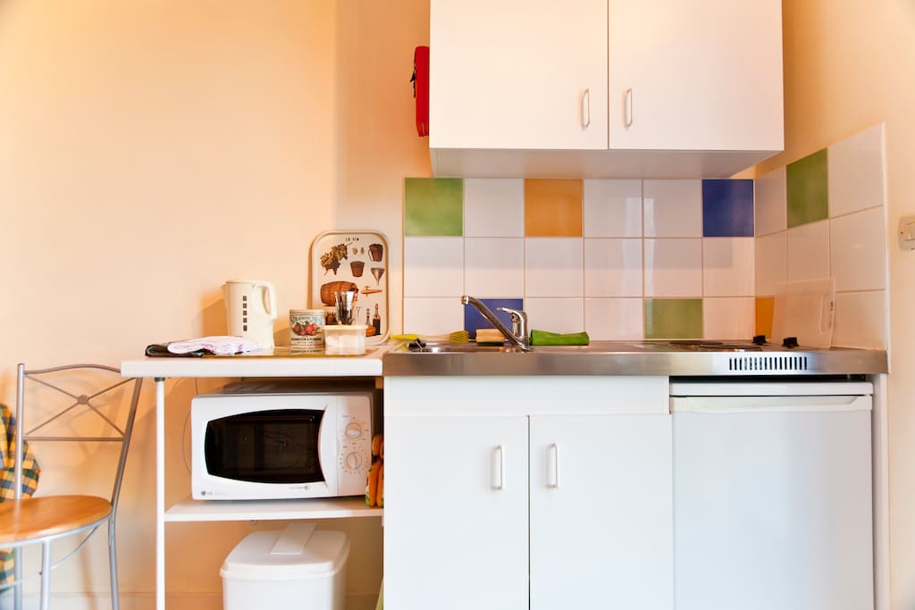 Mini-cuisine with microwave/combination grill, kettle, double hob.Cupboards with crockery, glassware, cutlery, pans etc.