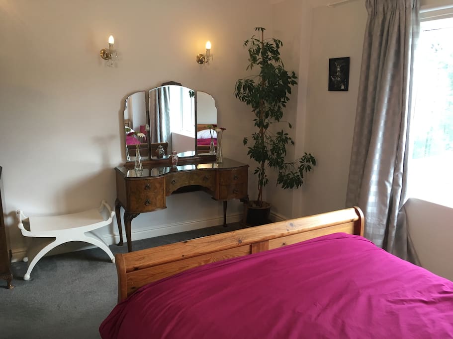 Double bedroom with chest of draws and wardrobe