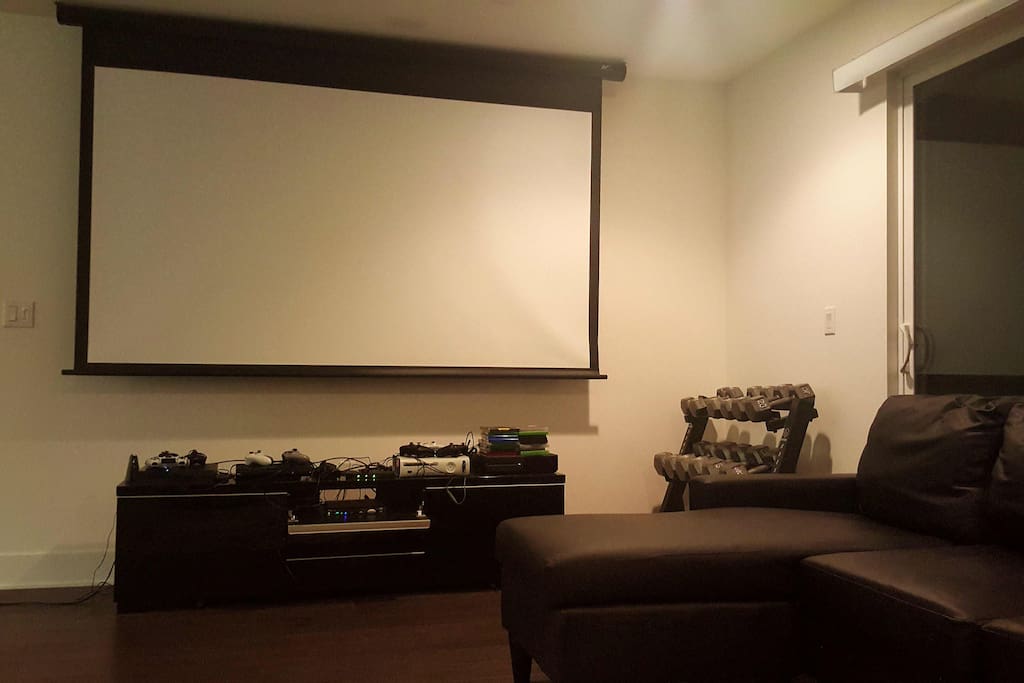 110" projector screen, weight lifting rack, Xbox 360 and Xbox One systems