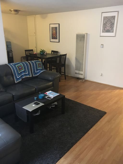 Living room leads into an open dining room.