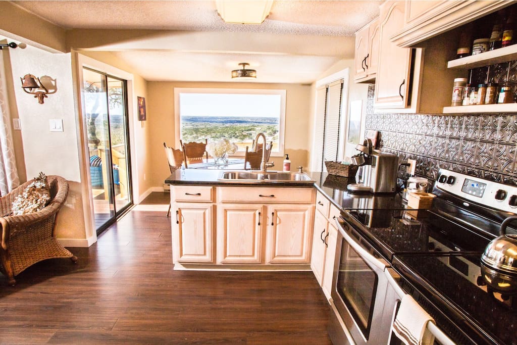 Second Fully Stocked Kitchen at The Nest with a gorgeous view from the picture window