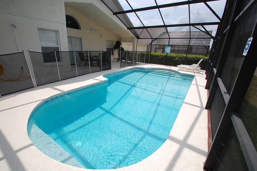 Pool with removable child safety pool enclosure fence