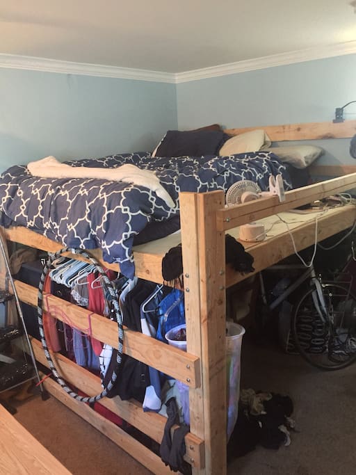 Big Loft bed whith queen size mattress. a person under 5'10 should be able to sit up comfortably in bed