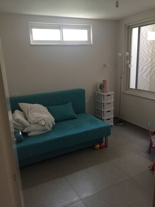 Second basement room with two comfortable sofa beds.