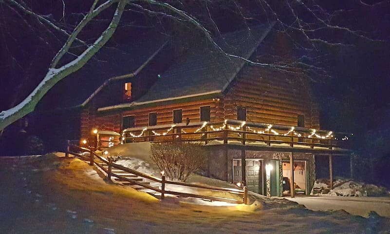 Cozy bedroom in our log home.