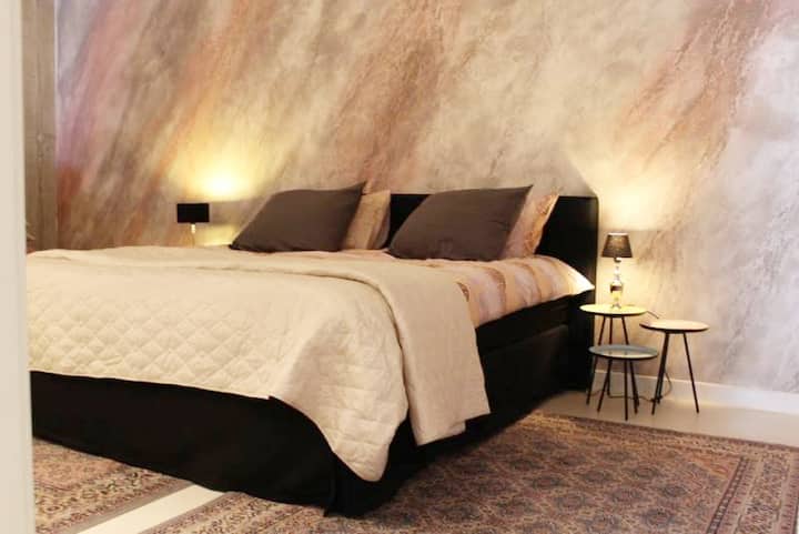 spacious bedroom with closet wall.