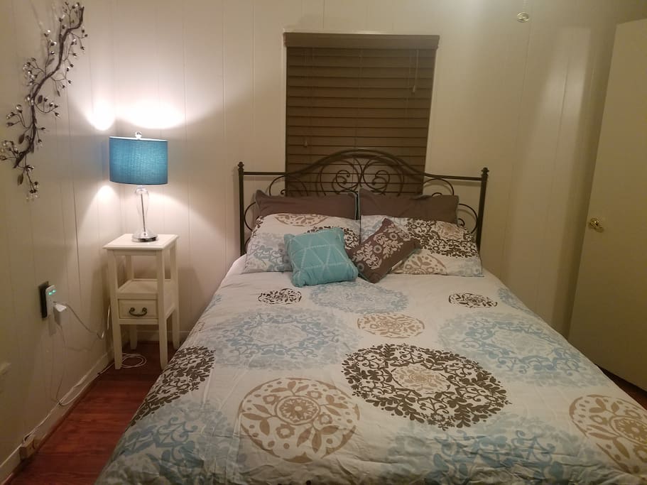 Queen size bed in private room with 2nd flat screen & full bathroom
