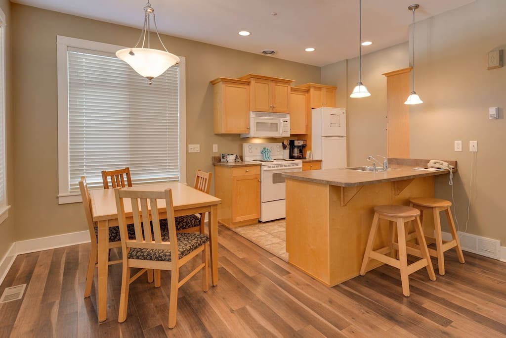 Sip a glass of Okanagan wine while preparing dinner in the modern, open-plan kitchen.
