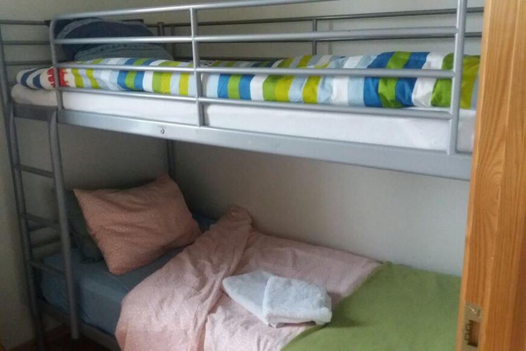 Bedroom with one single and one double loft bed
